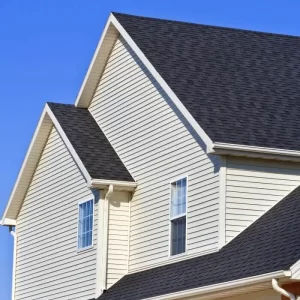 Residential roof replacement on a well-maintained suburban house