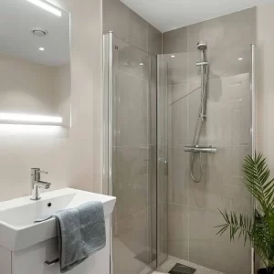 Bathroom remodeling project with updated fixtures and moisture resistant finishes